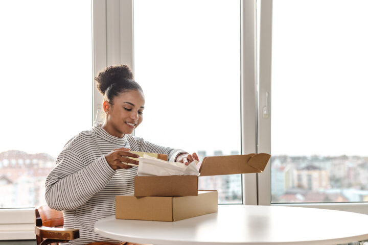Young woman has just received a package with online ordered items